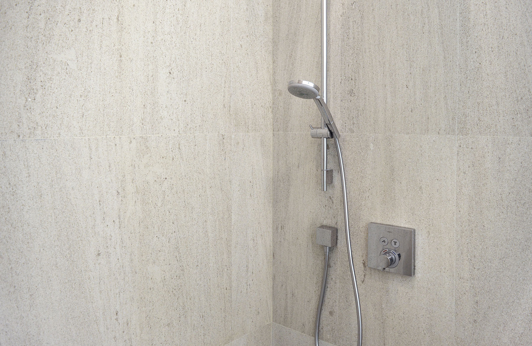 Mocca Cream medium limestone tiles featured on shower walls